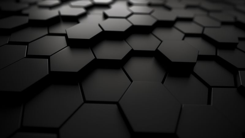 A sleek abstract design featuring black hexagons with sharp edges and subtle shading.