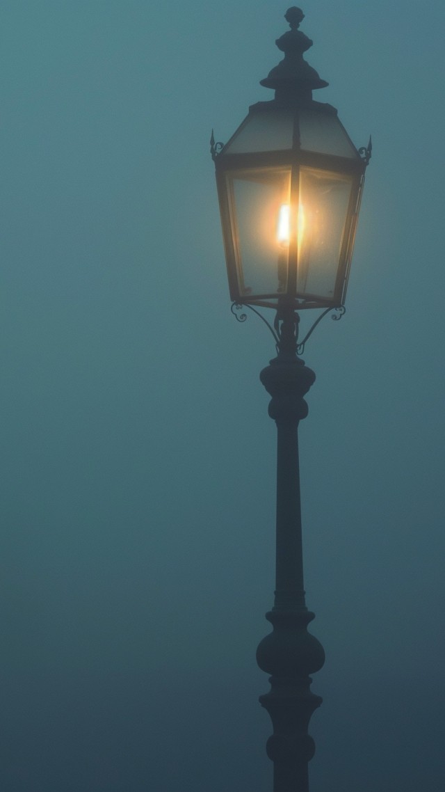 Street lamp in the fog wallpaper, foggy atmosphere, ambient glow, background for mobile wallpaper (vertical)