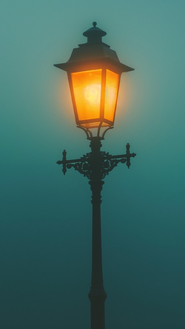 Street lamp in the fog wallpaper, misty atmosphere, dimly lit, background for mobile wallpaper (vertical)