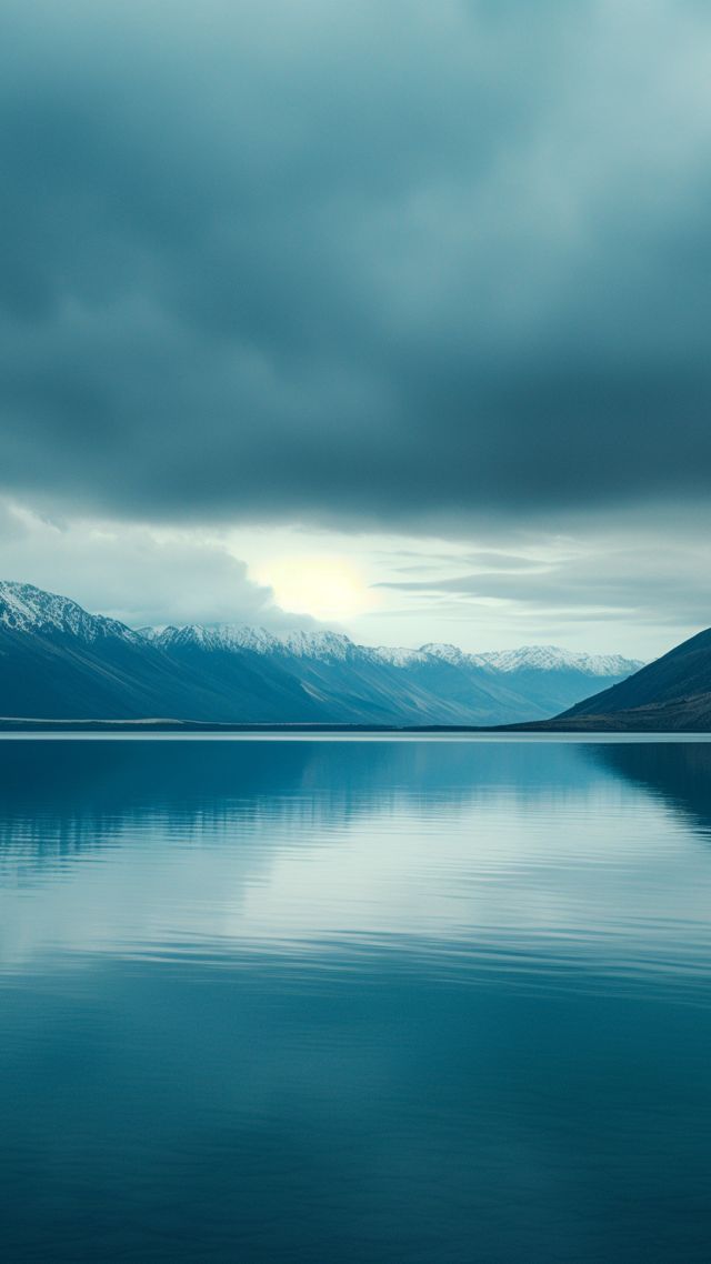 Lake Tekapo wallpaper, tranquil waters, majestic mountains, background for mobile wallpaper (vertical)